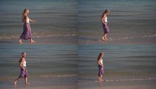 成熟女人在纱笼慢动作走在海滩上高清在线视频素材下载
