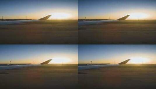 夕阳下飞机降落机场跑道上滑行高清在线视频素材下载