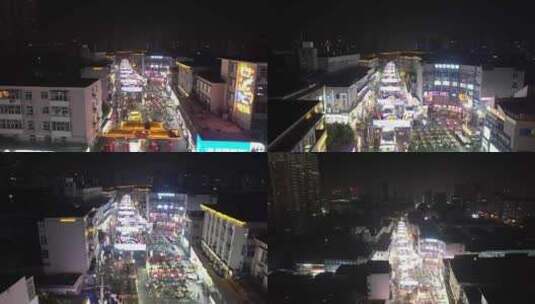 河南新乡市夜景步行街人流航拍高清在线视频素材下载