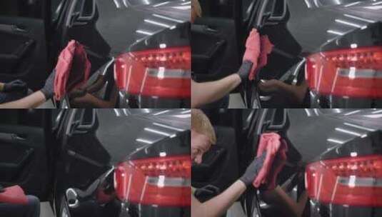洗车工人用毛巾擦亮车翼的照片。高清在线视频素材下载