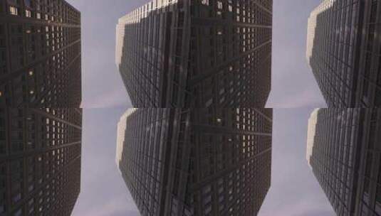 市中心街道低角度的两座城市摩天大楼高清在线视频素材下载