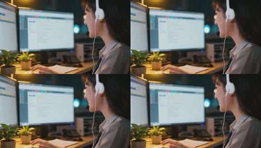 女性办公室戴耳机操作电脑高清在线视频素材下载