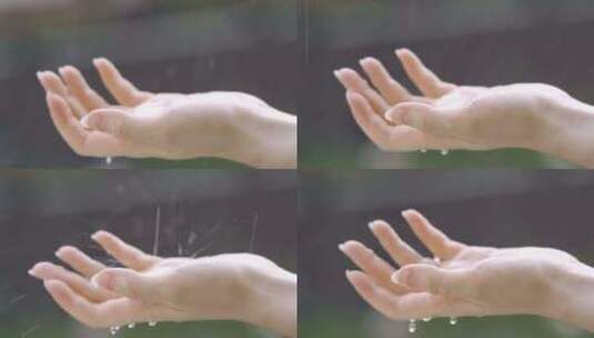 雨中的手。模糊背景下的手在雨中淋湿高清在线视频素材下载