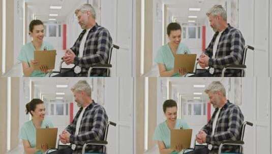 护士在医院走廊协助轮椅男子高清在线视频素材下载