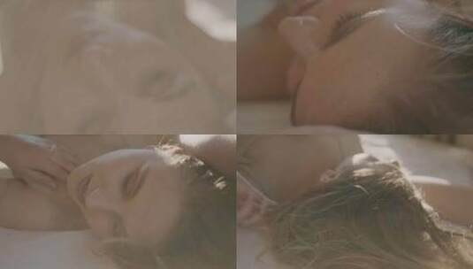 年轻女子躺在床上看着镜头高清在线视频素材下载