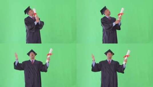穿着毕业礼服的男子亲吻毕业证书高清在线视频素材下载
