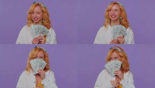 金发女人拿着钱对着镜头炫耀高清在线视频素材下载