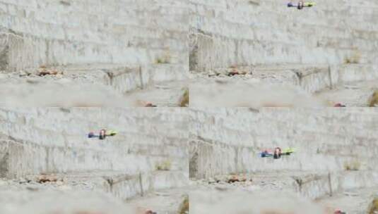 无人机在混泥土墙飞行高清在线视频素材下载