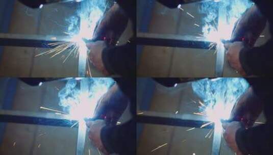 工人用工业焊机焊接钢结构高清在线视频素材下载