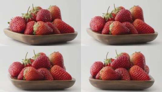 旋转拍摄碗中新鲜草莓高清在线视频素材下载
