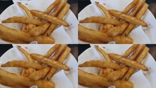 中餐馆内桌上炸薯条的动作4k高清在线视频素材下载