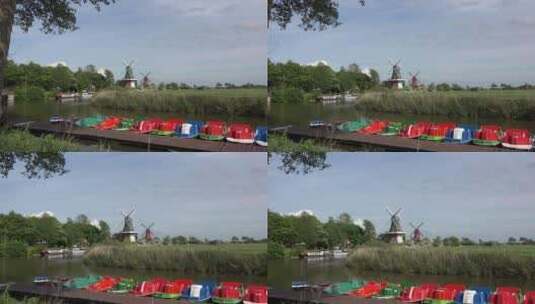 五颜六色的船和放大的风车景观高清在线视频素材下载
