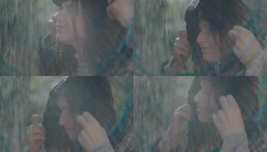 大雨中戴上帽子的女人高清在线视频素材下载