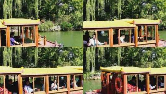 山东济南大明湖公园景区游客在湖面乘坐游船高清在线视频素材下载