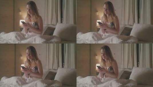 在床上看手机的女人高清在线视频素材下载