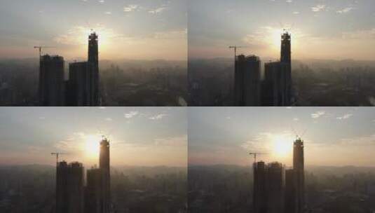 4K航拍城市高楼吊塔日出彩霞高清在线视频素材下载