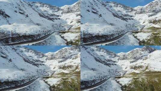 航拍西藏雪山盘山公路上行驶的汽车高清在线视频素材下载