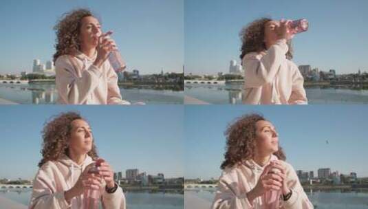 女人在海边喝水高清在线视频素材下载