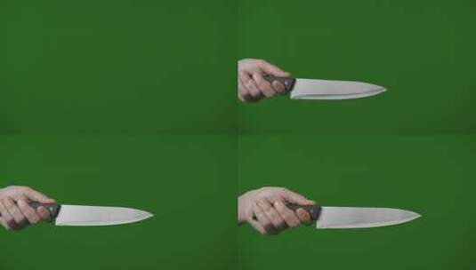 4K持刀杀手或疯子的剪影。巨大的肉刀，在绿色背景上的男性手中。高清在线视频素材下载