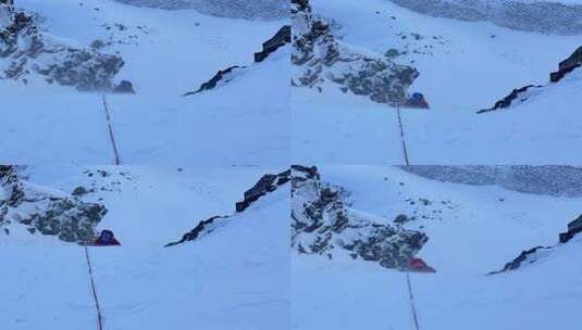 攀登四川阿坝岷山山脉主峰雪宝顶的登山者高清在线视频素材下载