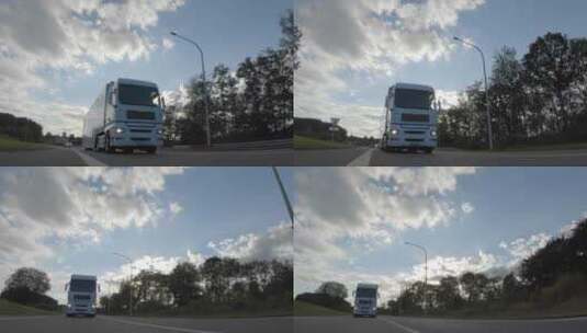 一辆白色的货运卡车在公路上高速行驶高清在线视频素材下载
