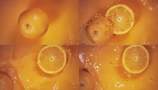 半个橘子落入果汁中高清在线视频素材下载