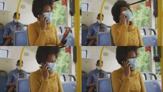 戴口罩的黑人女性在公交车上打手机高清在线视频素材下载