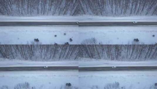 冬季森林里雪地公路上行驶的汽车高清在线视频素材下载