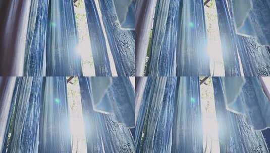 阳光透过蓝色花纹窗帘高清在线视频素材下载