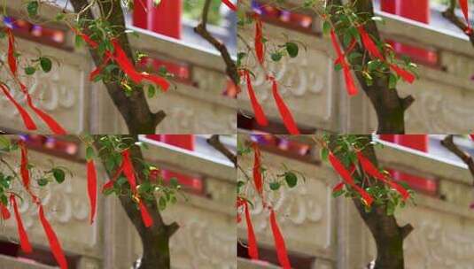 4K寺庙祈福飘动的红丝带实拍视频高清在线视频素材下载
