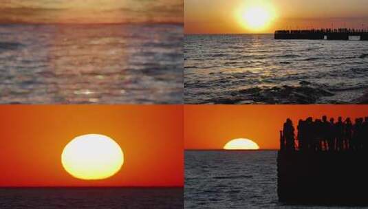 海面日落晚霞金海湾栈桥人群剪影高清在线视频素材下载