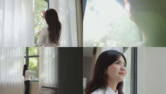 女生触摸阳光看窗外高清在线视频素材下载