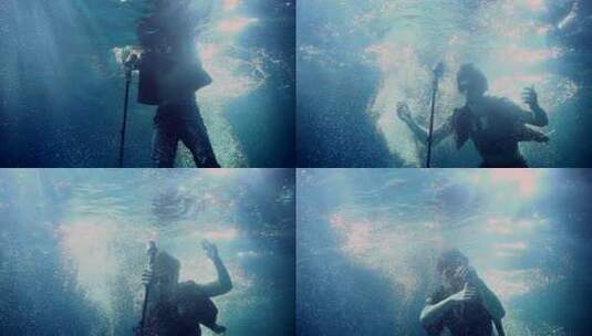 水下摄影：人物在阳光照射下的潜水瞬间高清在线视频素材下载
