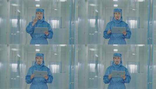 无菌车间女工操作平板数据监控数字化管理高清在线视频素材下载