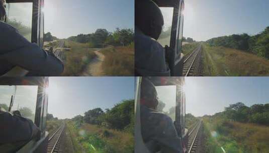 非洲坦赞铁路上行驶的火车阳光下的火车轨道与绿色植被高清在线视频素材下载
