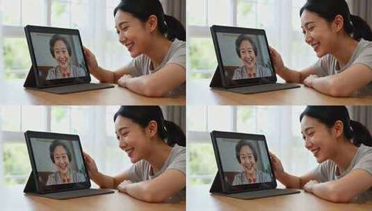 女人通过平板与老人视频通话高清在线视频素材下载