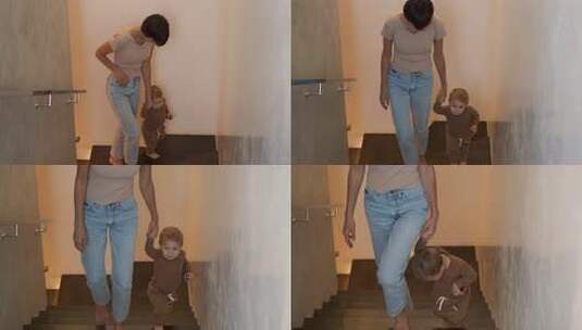 母亲牵婴儿在家中楼梯学步高清在线视频素材下载