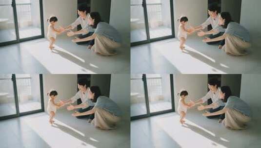 父母引导婴儿室内学步高清在线视频素材下载