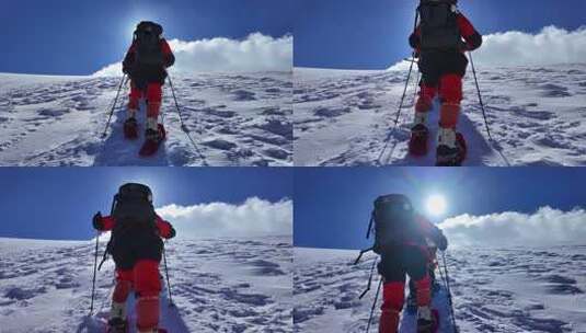 风雪中攀登慕士塔格雪山的登山者高清在线视频素材下载