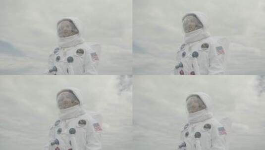 宇航员在白云下环顾四周高清在线视频素材下载