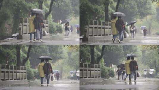 闺蜜雨中挽手散步高清在线视频素材下载