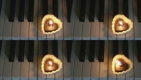 钢琴上的心形蜡烛高清在线视频素材下载