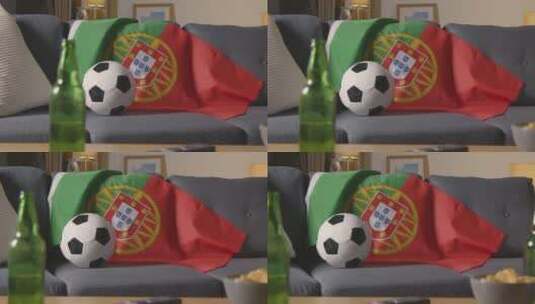 沙发上的葡萄牙国旗和足球特写高清在线视频素材下载