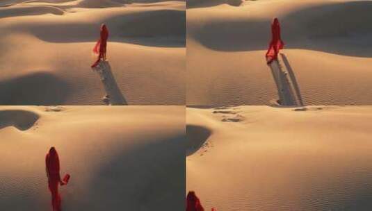 红衣女子行走在沙漠里高清在线视频素材下载