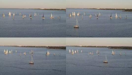 阳光明媚的一天，小艇漂流在路易斯安那州新奥尔良的庞恰特雷恩湖上。无人驾驶飞机轨道高清在线视频素材下载