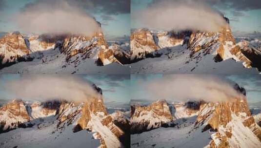 航拍阳光下的雪山日出巍峨山峰云雾飘动高清在线视频素材下载