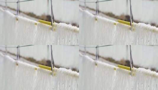 晾晒在竹竿上的农家手工粉条高清在线视频素材下载