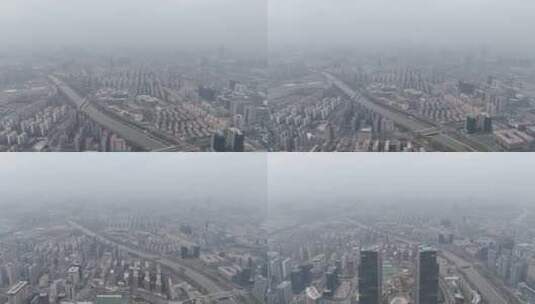 郑州东区雾霾天高楼林立护城河后飞双子塔高清在线视频素材下载