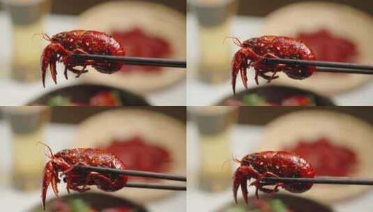 筷子夹起小龙虾夜宵美食特写高清在线视频素材下载