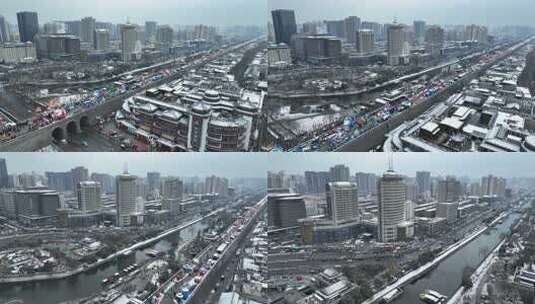 航拍陕西省西安市西安古城城楼大雪纷飞景观高清在线视频素材下载